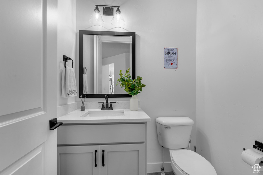Half bath with toilet and vanity