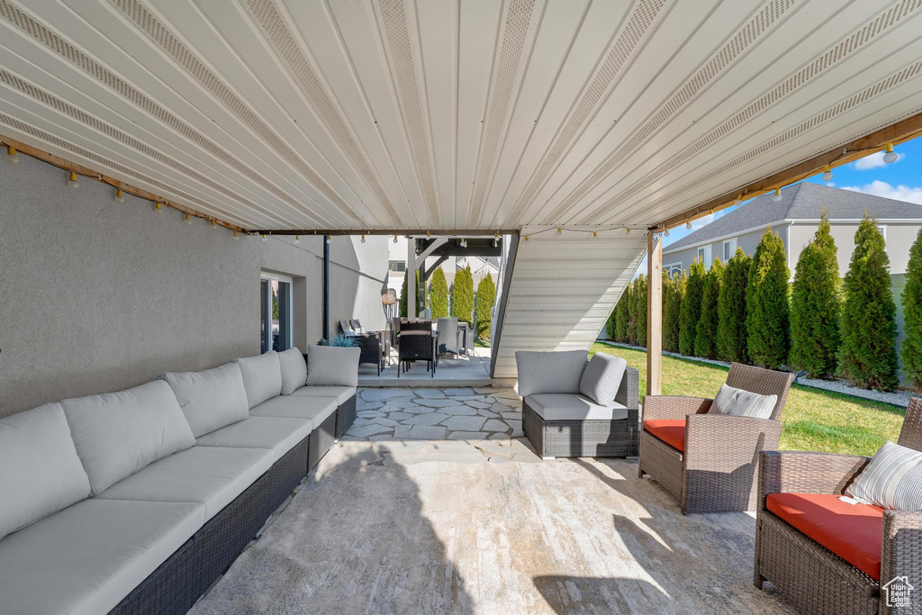 View of patio with an outdoor living space and outdoor dining space