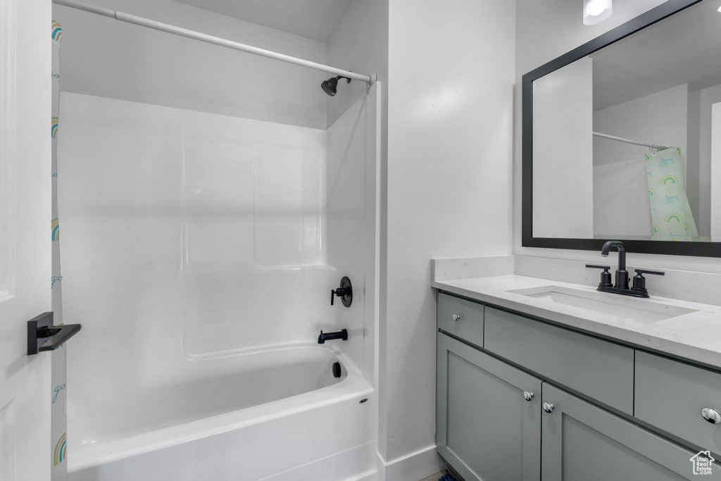Full bathroom featuring shower / tub combo and vanity