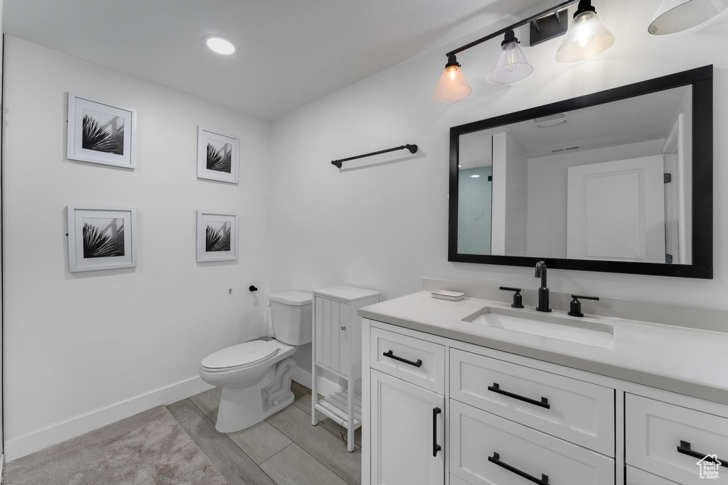 Bathroom with toilet and vanity