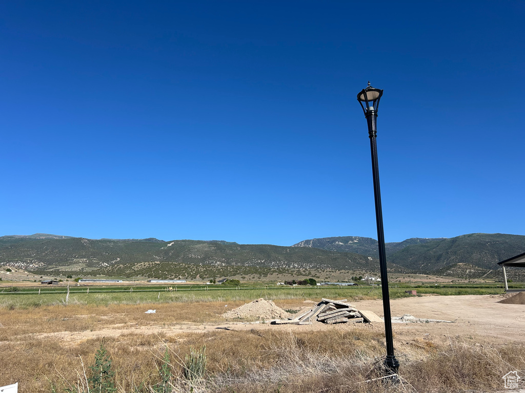 View of mountain backdrop featuring rural landscape
