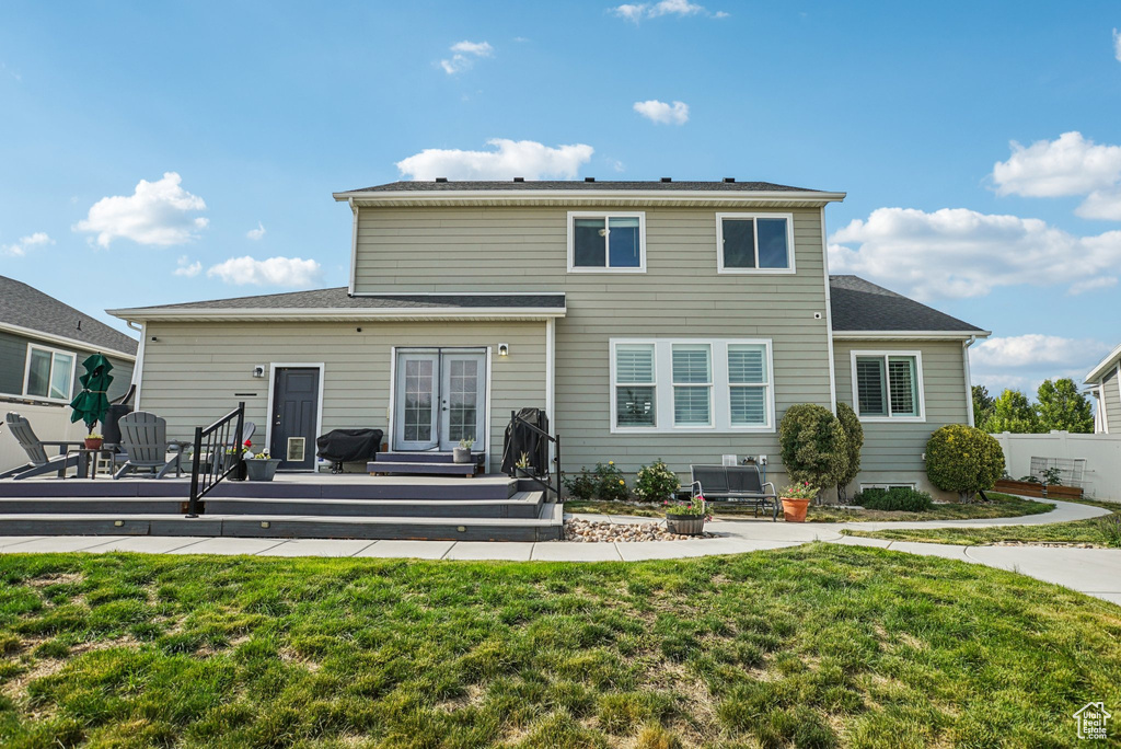 Rear view of house with french doors and a deck