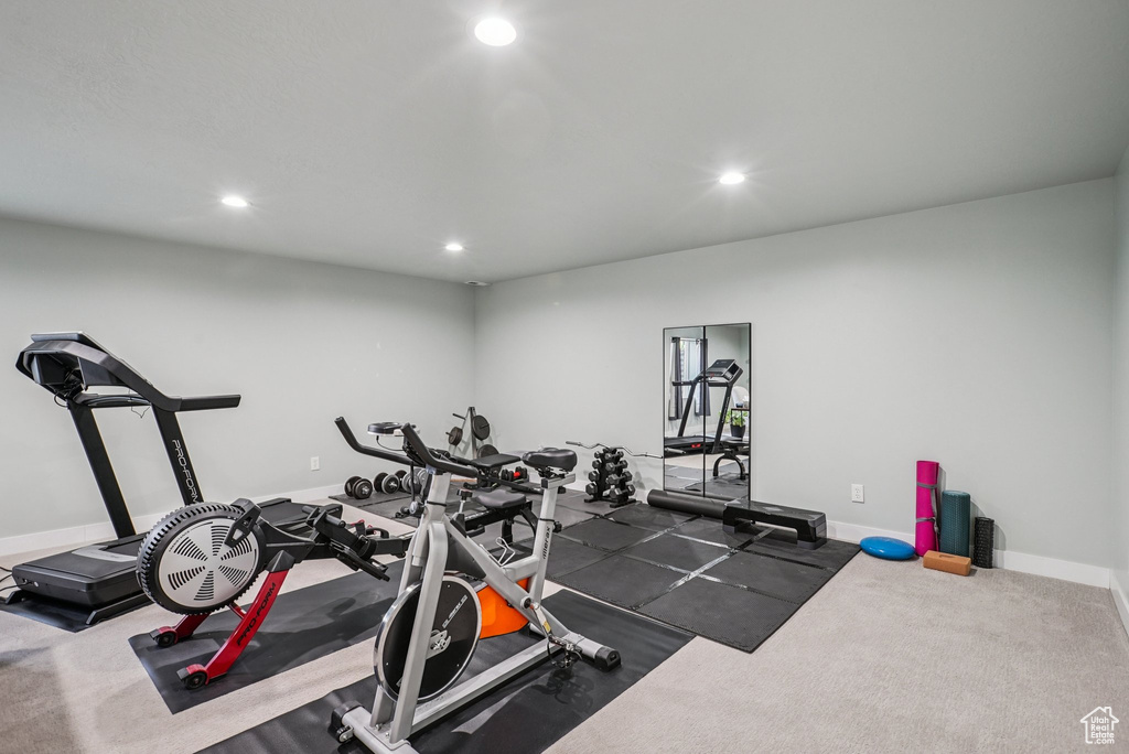 Workout room with recessed lighting and baseboards