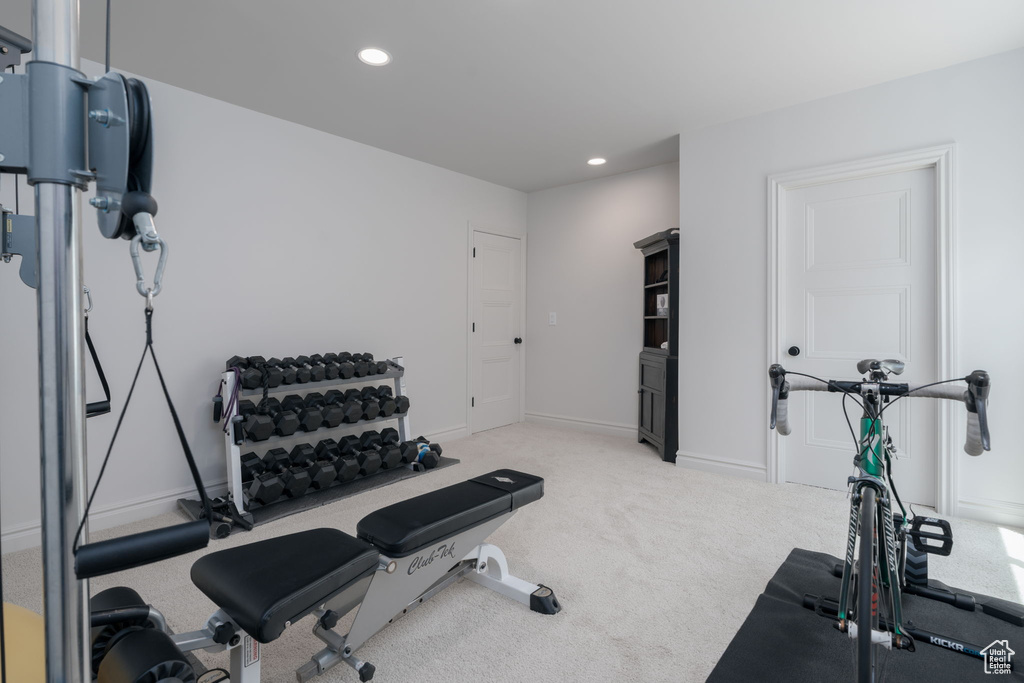 Workout area with recessed lighting and light carpet