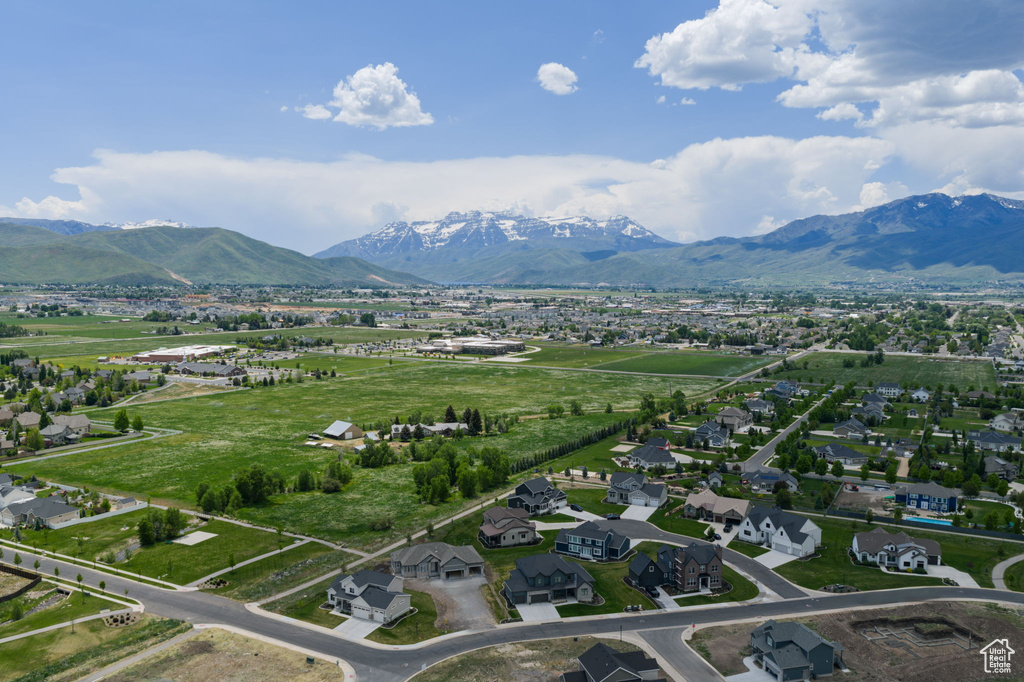 Aerial view of residential area featuring a mountainous background