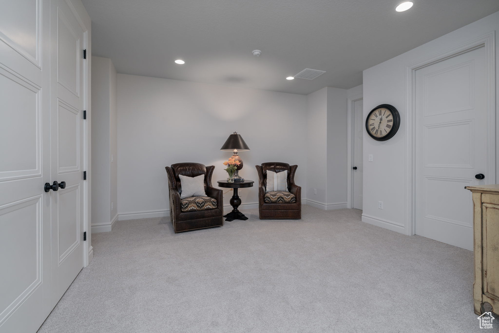 Sitting room featuring carpet and recessed lighting