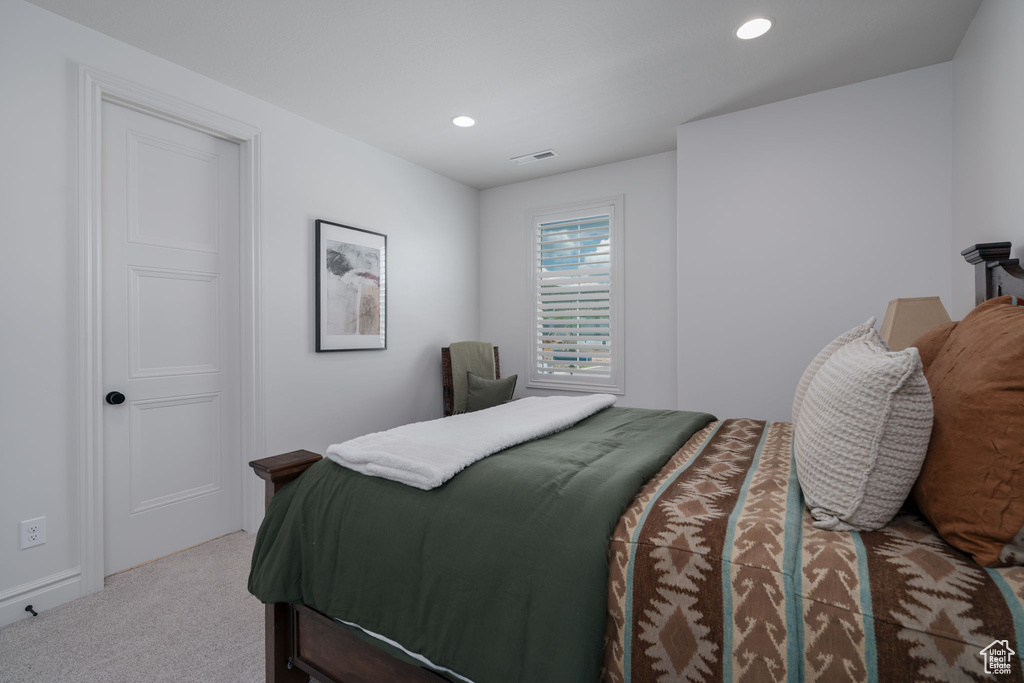 Carpeted bedroom featuring recessed lighting