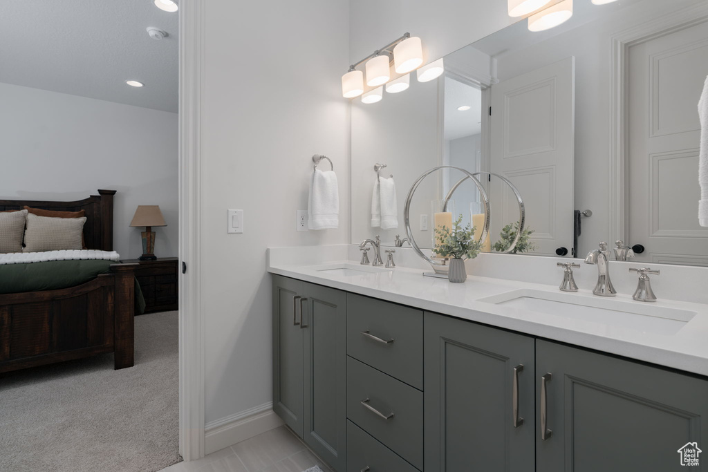 Full bath featuring double vanity and recessed lighting