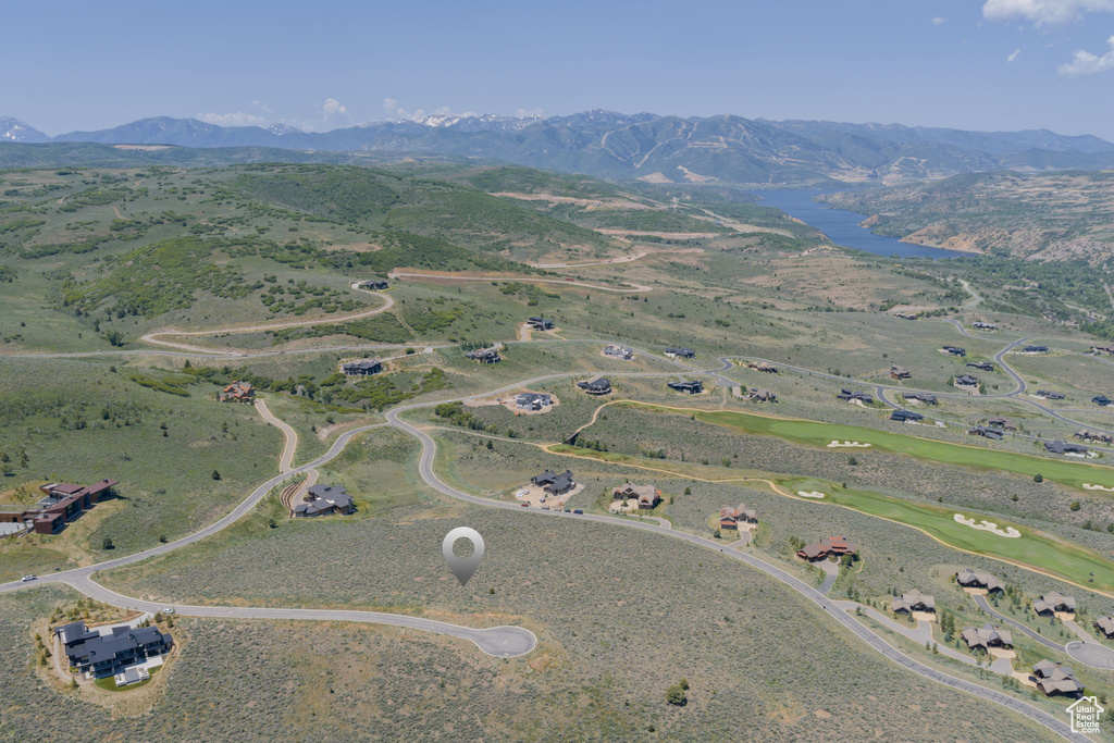 Aerial overview of property's location with a mountain backdrop