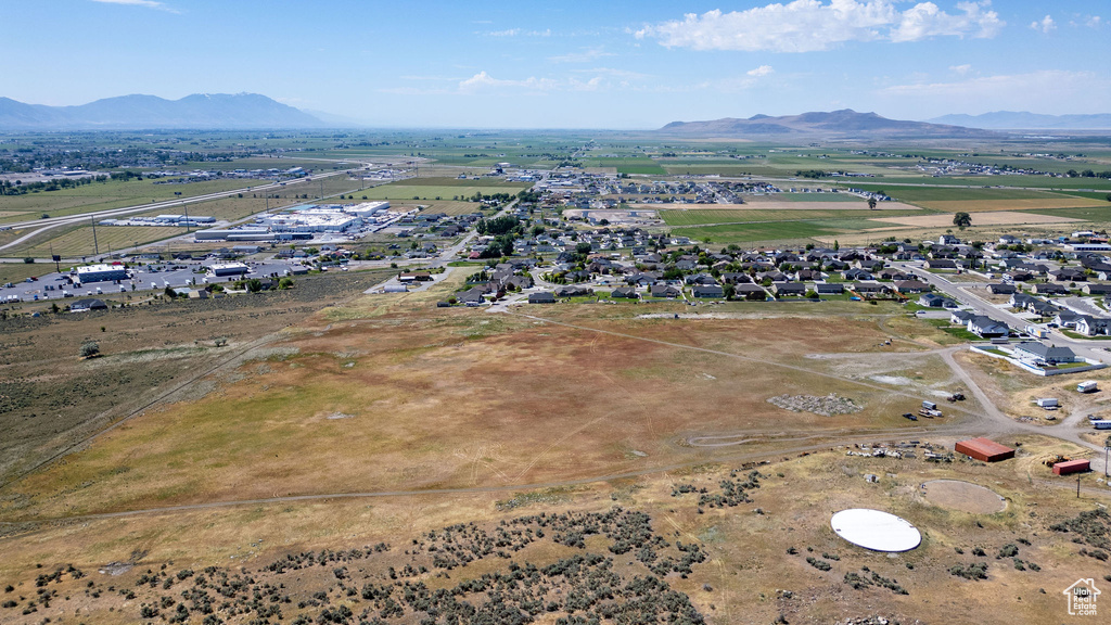 Aerial overview of property's location with a mountainous background
