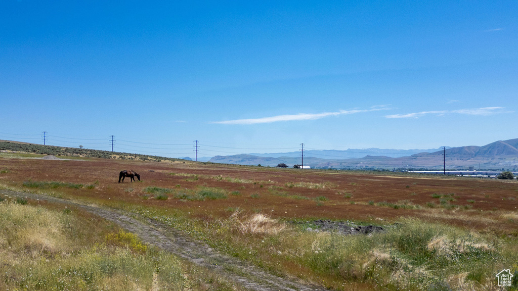 View of mountain backdrop featuring rural landscape