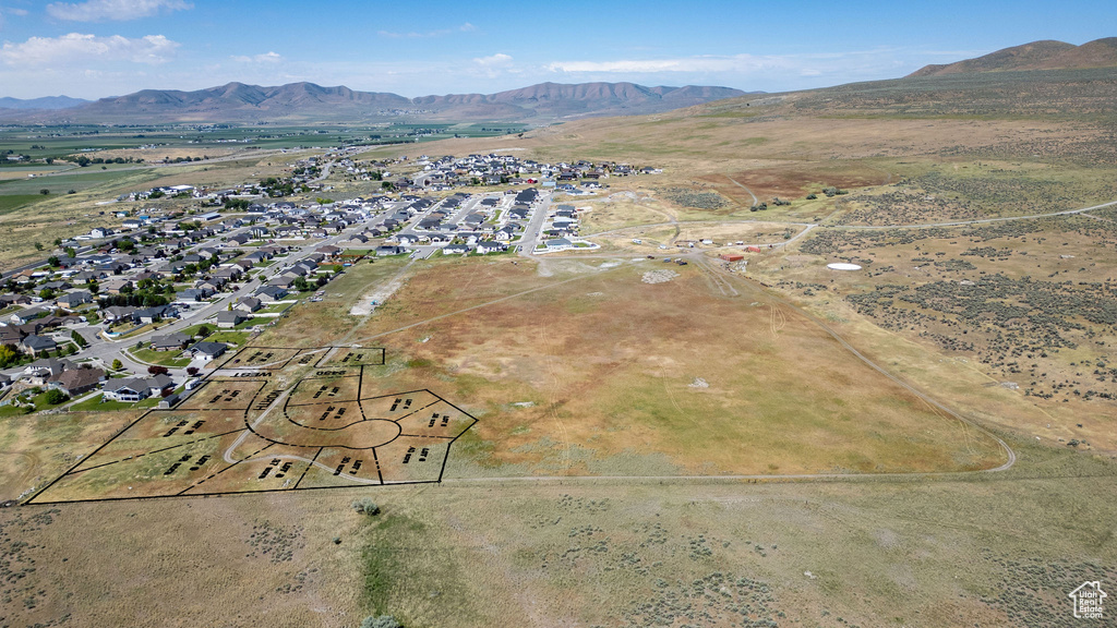 Aerial overview of property's location with a mountainous background