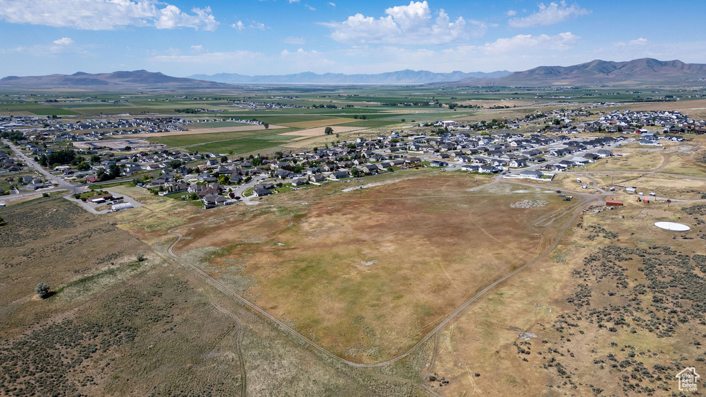 Aerial view of residential area featuring a mountain backdrop