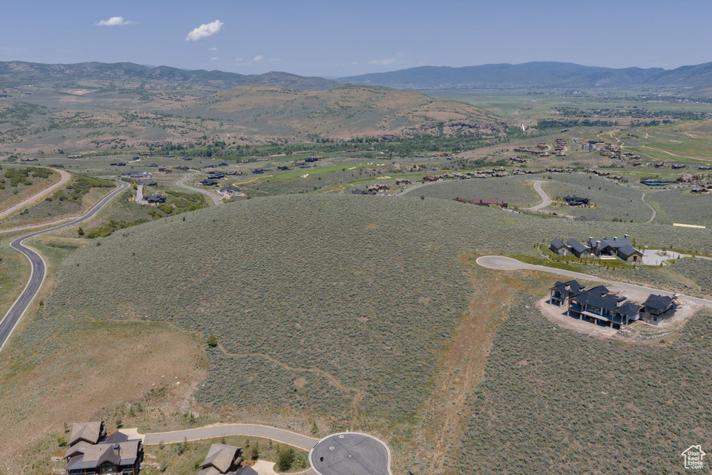 Aerial view of property's location with mountains