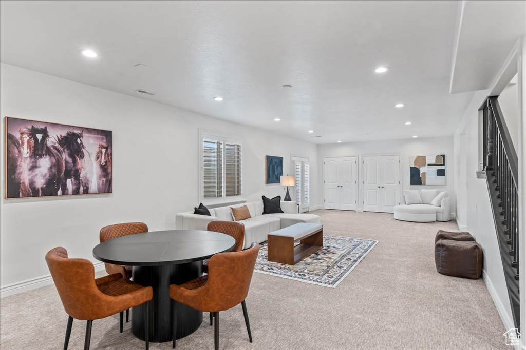 Carpeted dining room featuring recessed lighting