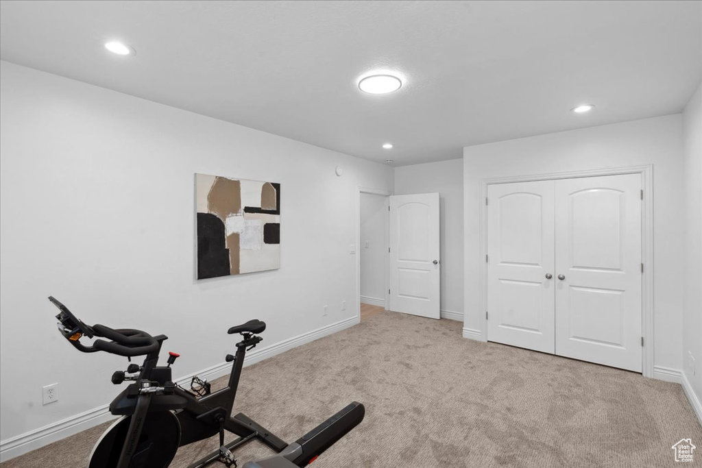Workout room featuring carpet and recessed lighting