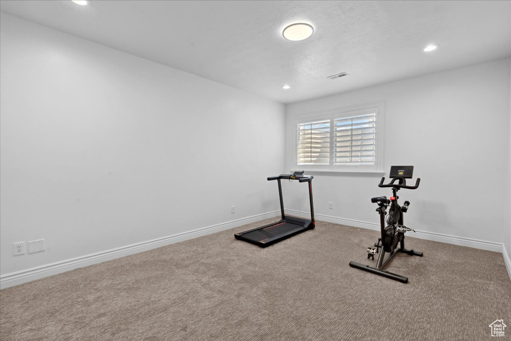 Exercise room featuring carpet and recessed lighting