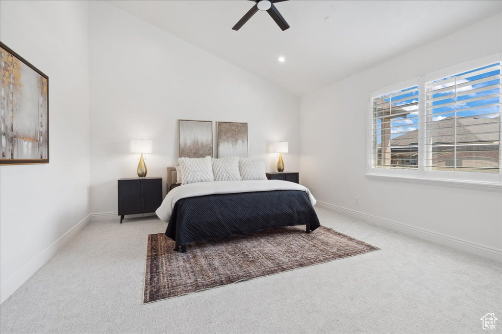 Bedroom with carpet floors, a ceiling fan, recessed lighting, and high vaulted ceiling