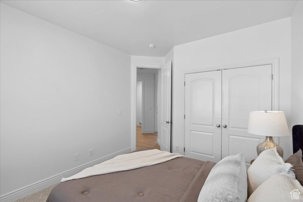 Bedroom with baseboards and a closet
