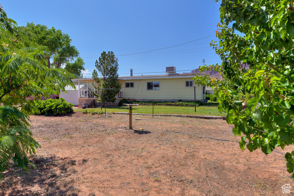Rear view of house featuring crawl space