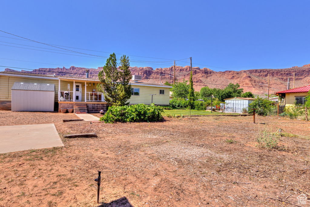 Back of house featuring a mountain view