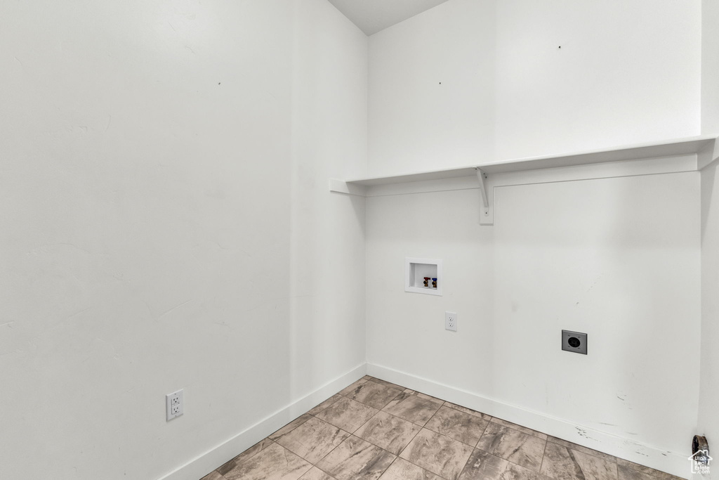 Washroom featuring hookup for a washing machine and hookup for an electric dryer