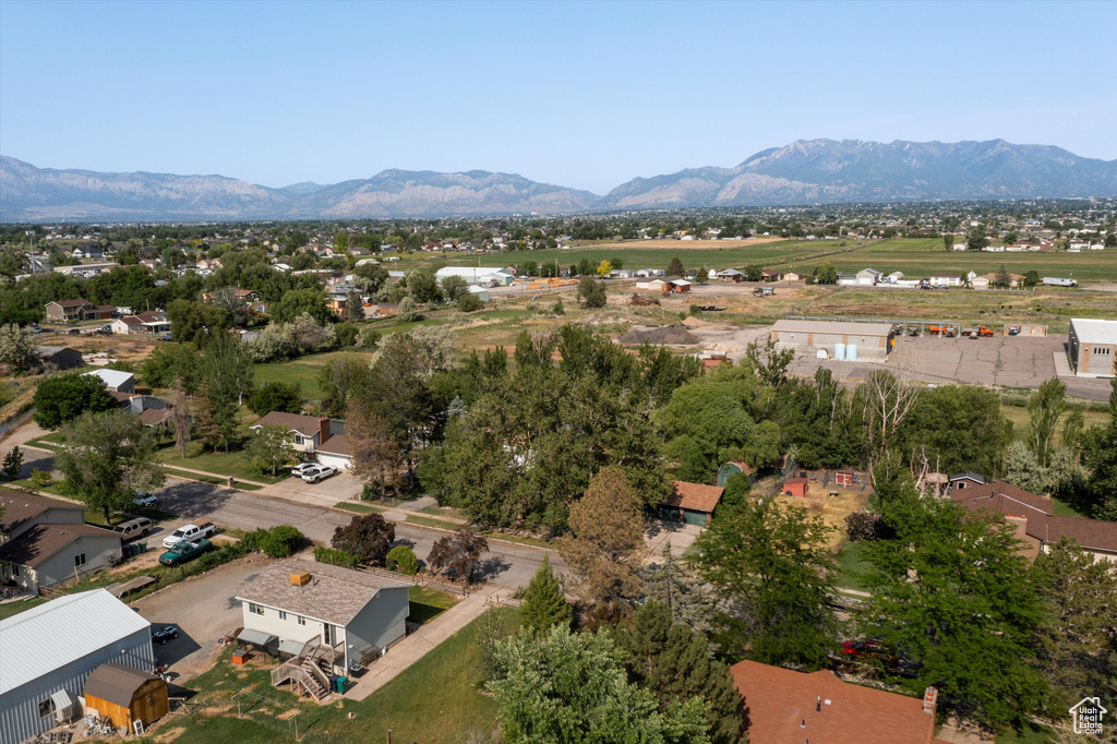 Aerial view of residential area featuring a mountain backdrop