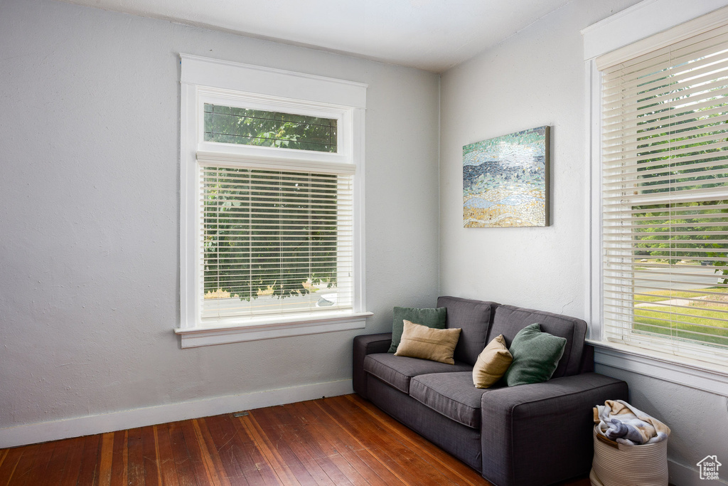 Sitting room with hardwood / wood-style floors and baseboards