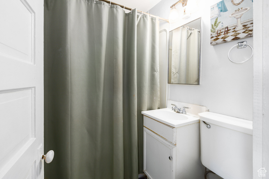 Bathroom featuring vanity and toilet