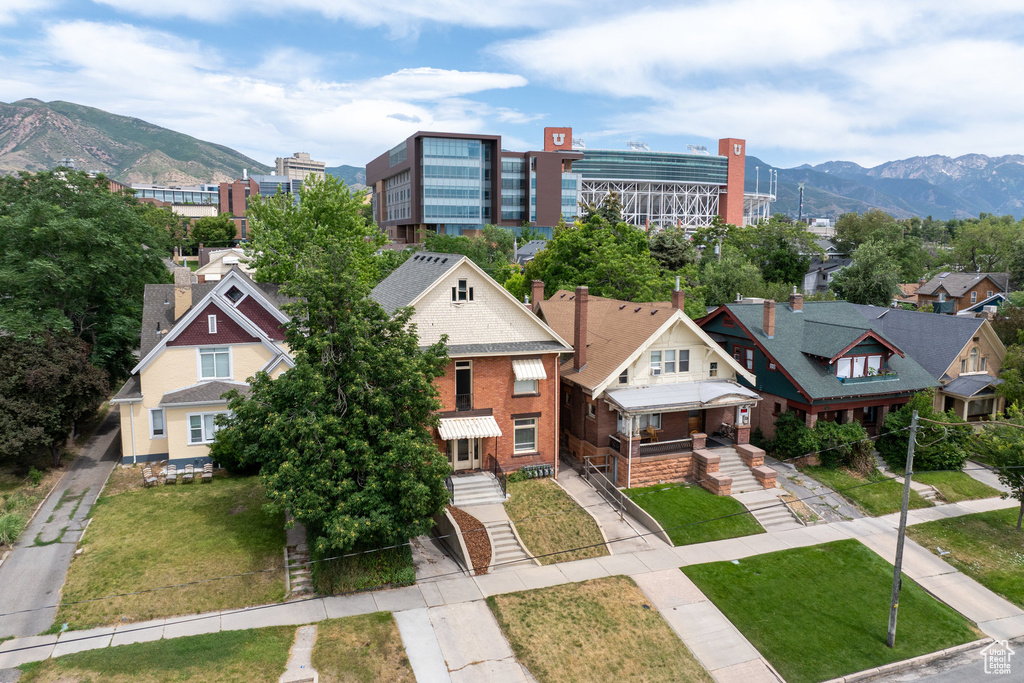 Aerial perspective of suburban area featuring a mountainous background