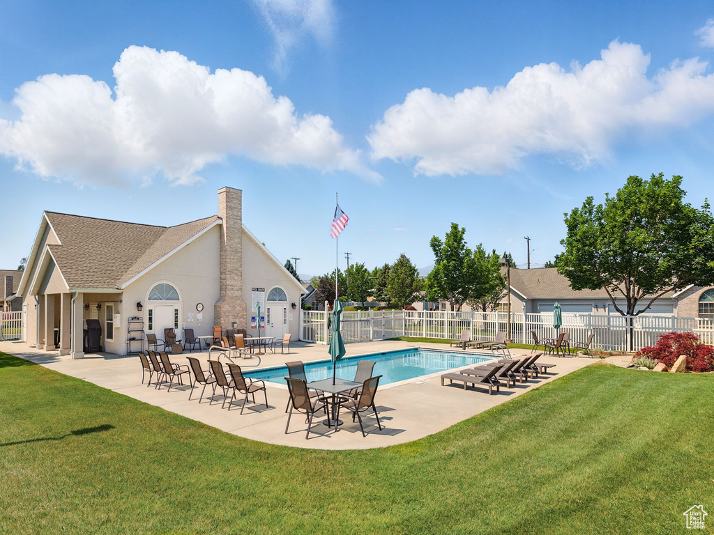 Community pool featuring a patio