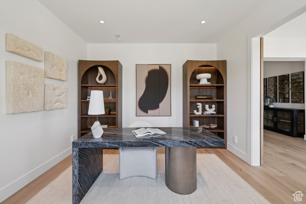 Home office featuring light wood-style flooring and recessed lighting