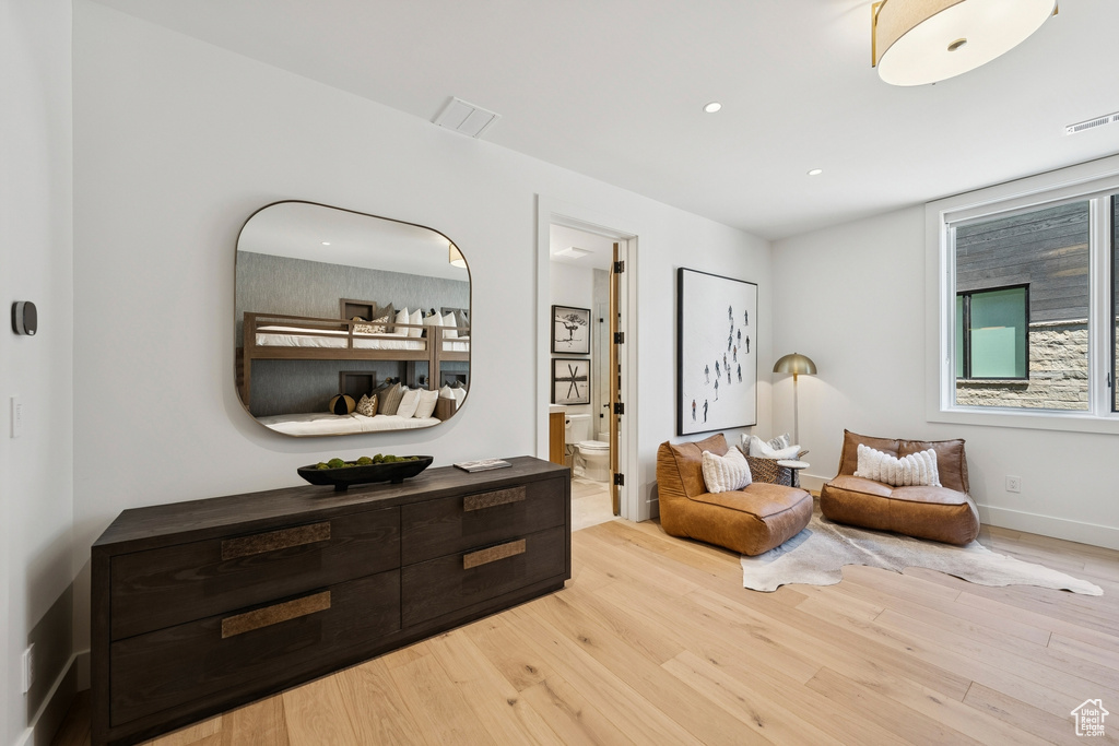 Sitting room featuring wood finished floors and recessed lighting