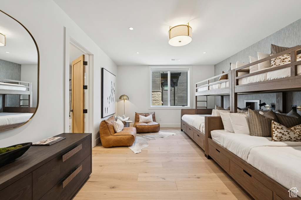 Bedroom with light wood-type flooring and recessed lighting