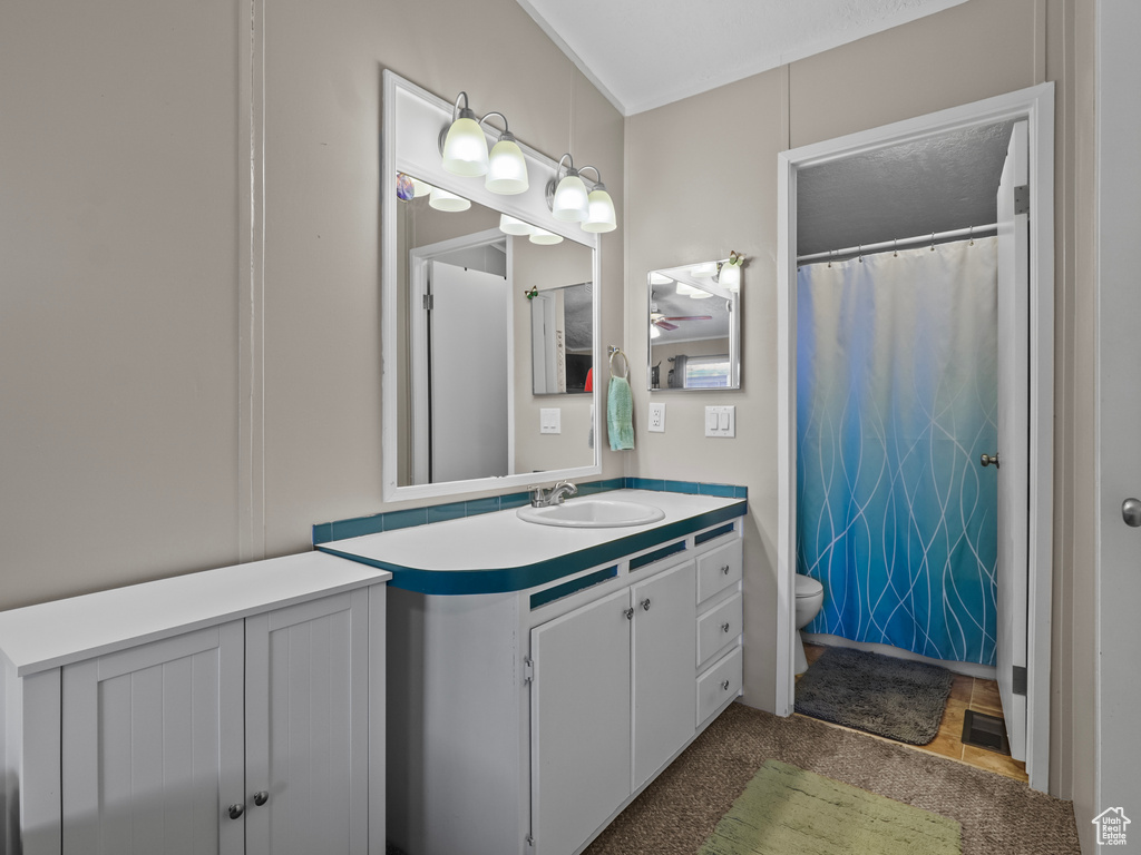 Bathroom featuring toilet and vanity