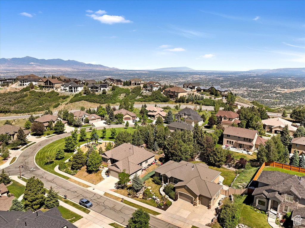 Aerial view of residential area featuring a mountain backdrop