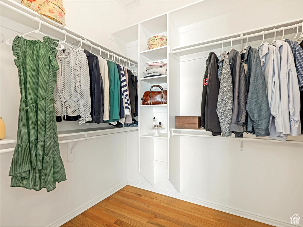 Spacious closet with wood finished floors