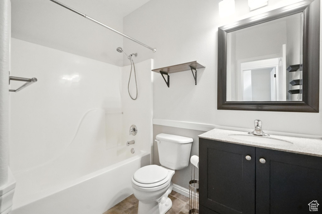 Full bathroom with vanity, shower / washtub combination, and wood finished floors