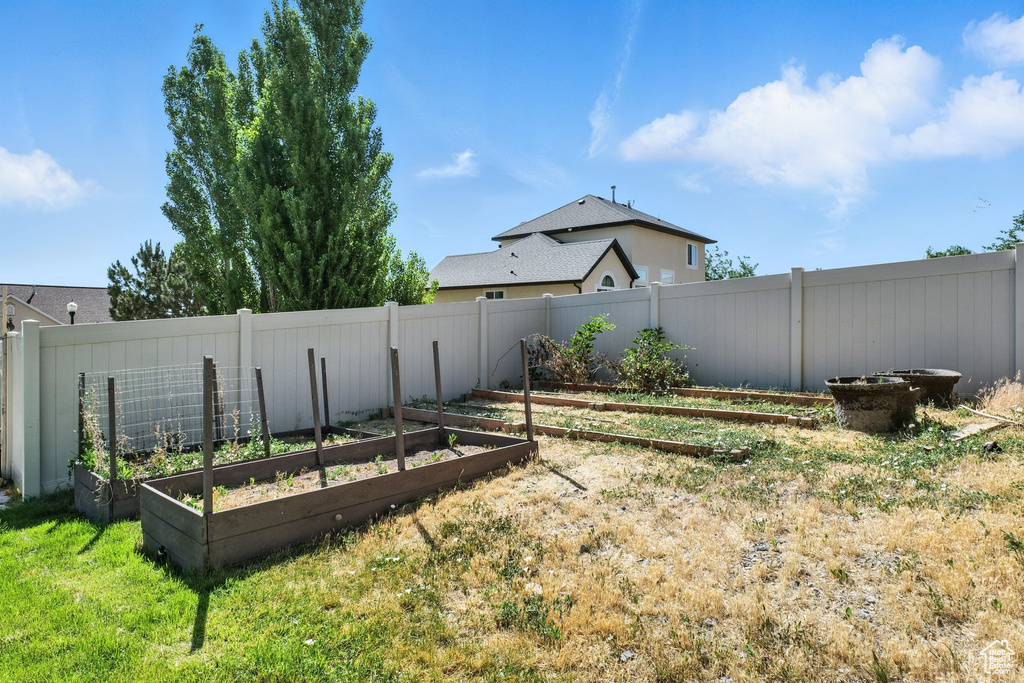 View of yard with a vegetable garden