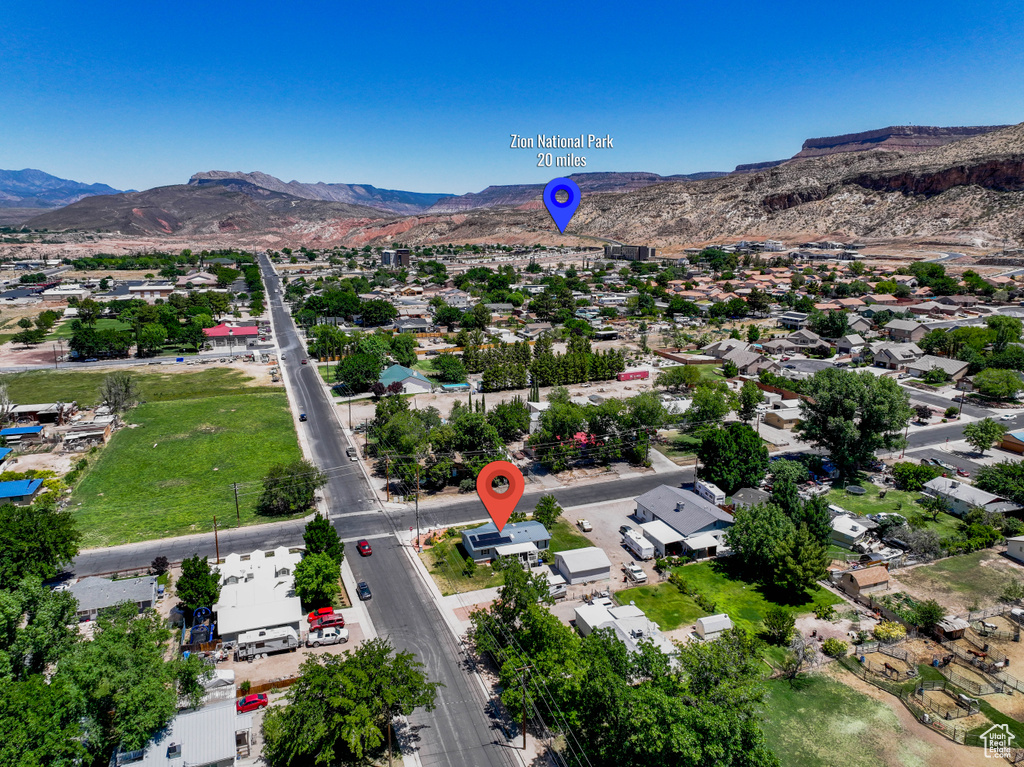 Aerial view of residential area with a mountainous background