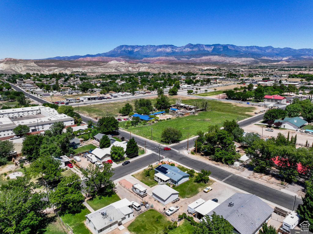Aerial perspective of suburban area featuring a mountain backdrop
