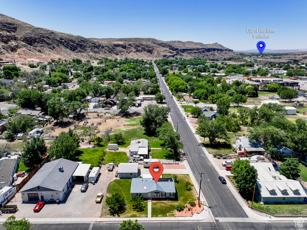 Aerial perspective of suburban area with a mountainous background