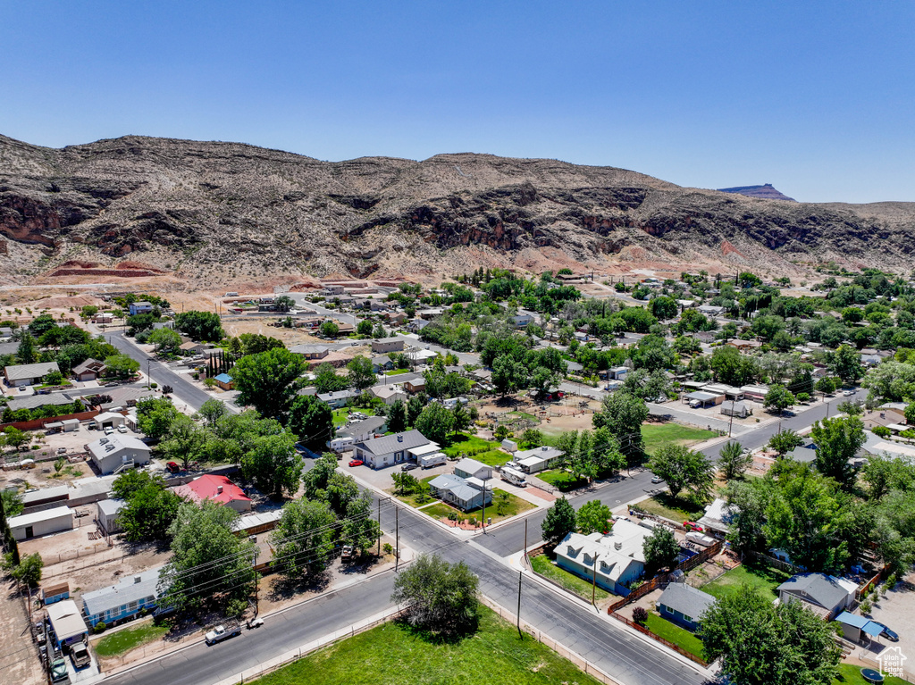 Aerial view of residential area featuring a mountain backdrop