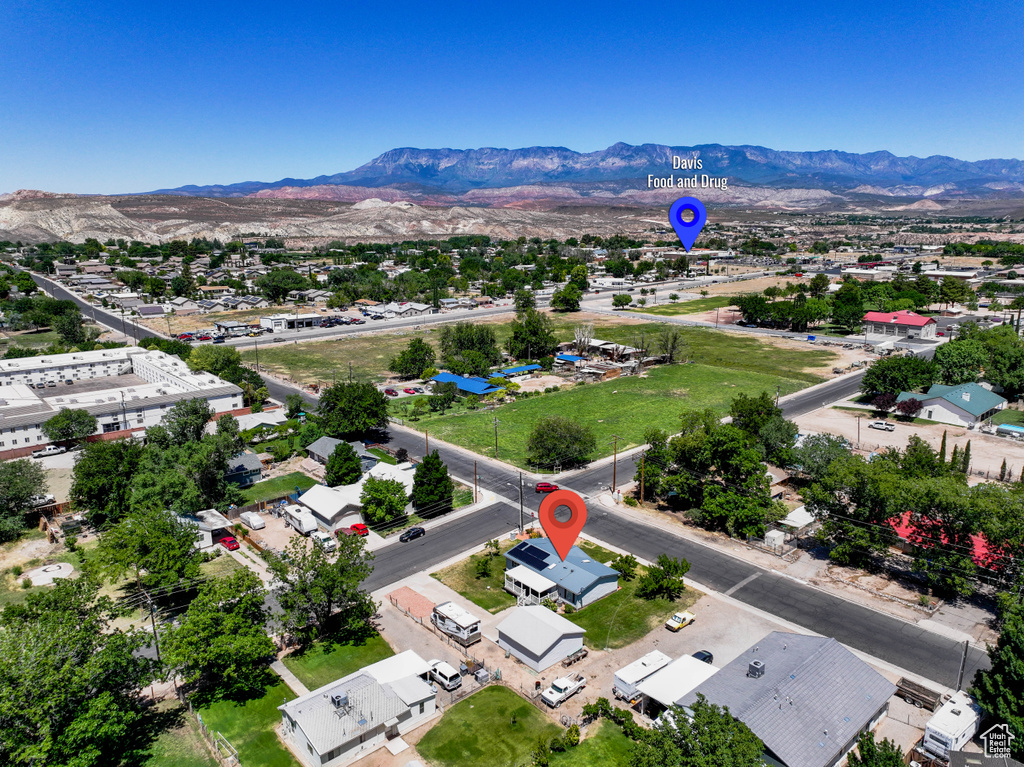 Aerial view of residential area featuring mountains