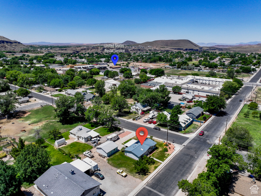 Aerial view of residential area featuring a mountain backdrop