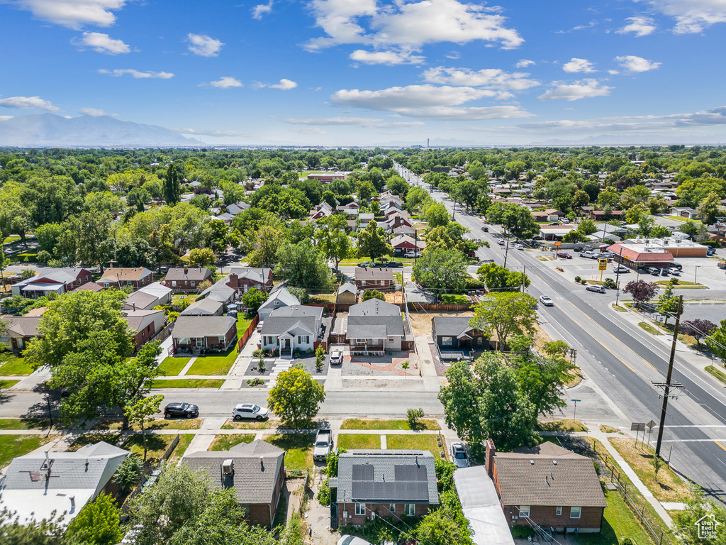 Aerial perspective of suburban area with a mountain backdrop