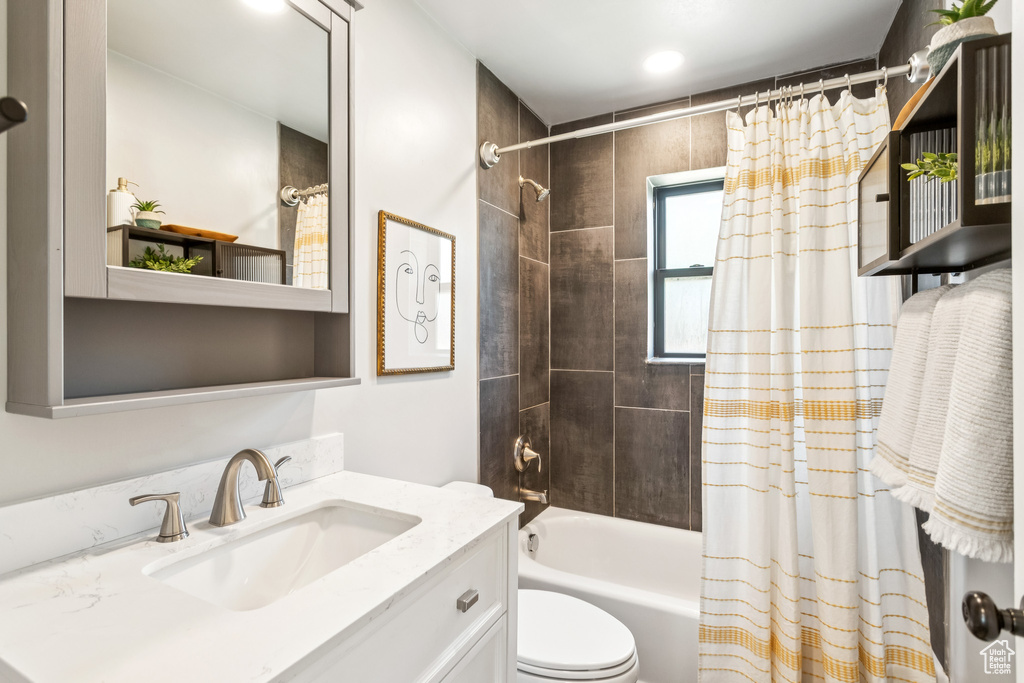 Full bathroom with vanity and shower / bath combo