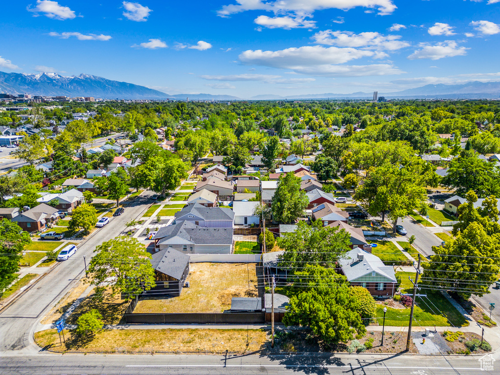 Aerial view of residential area featuring a mountain backdrop