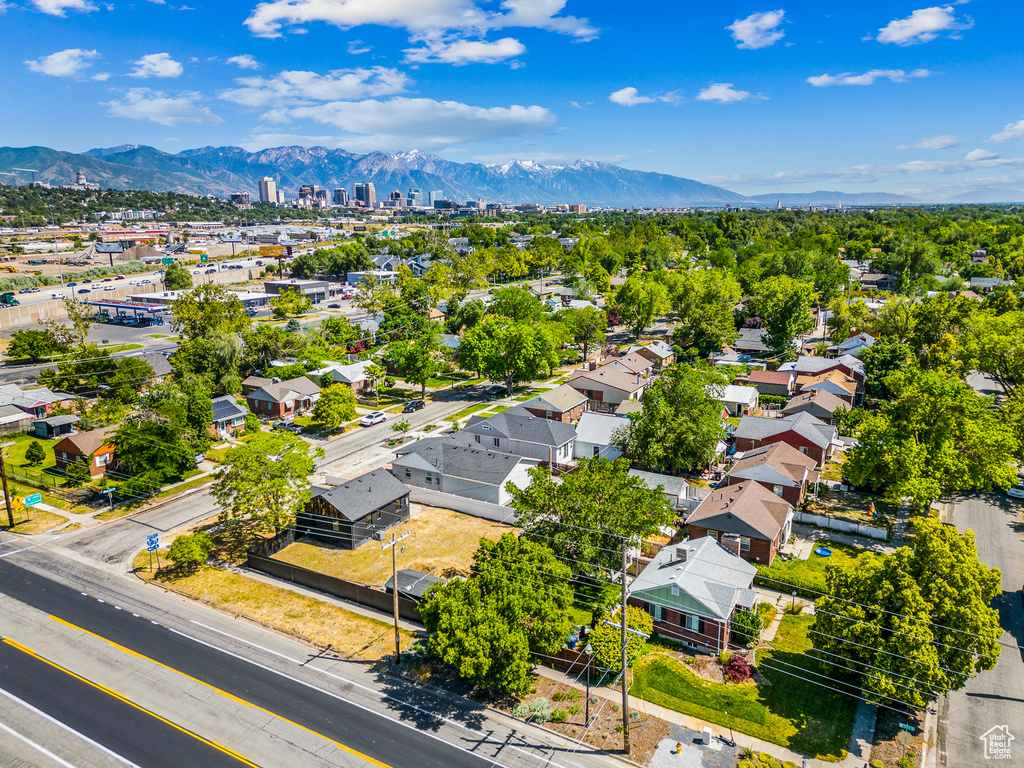 Aerial view of residential area featuring a mountainous background
