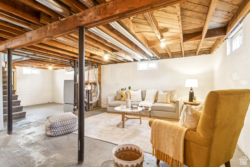 Basement featuring stairs and healthy amount of natural light